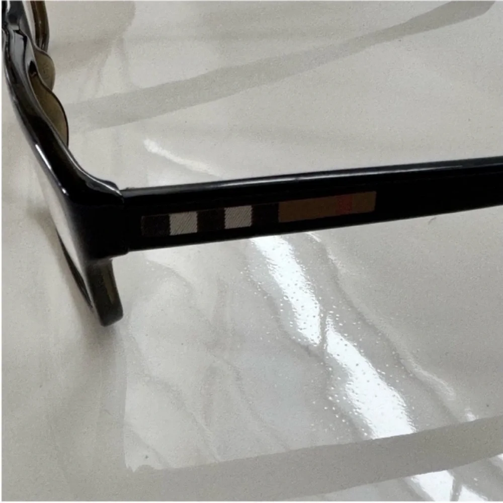 Burberry Elegant Black and Brown Glasses